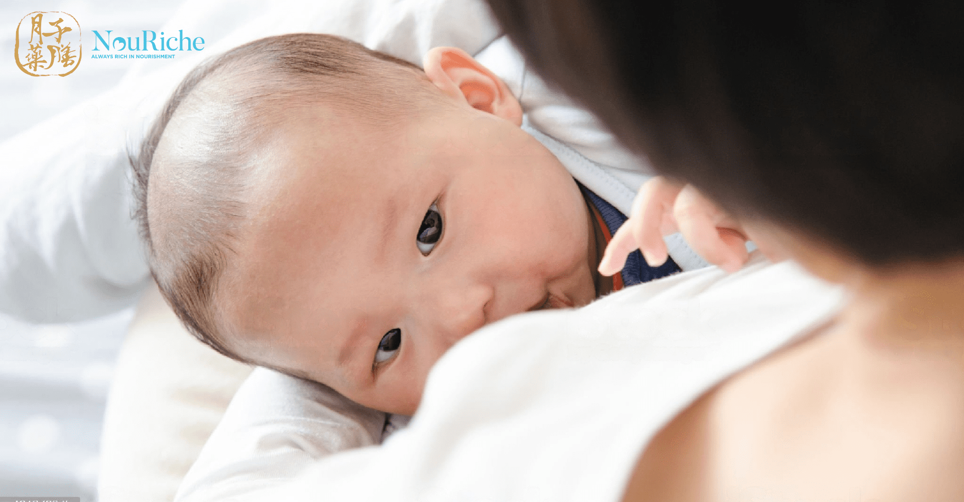 a mum breast feeding her newborn - Confinement Tips for new moms